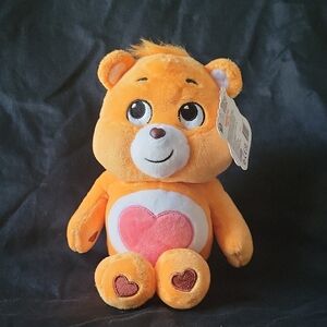Charming Orange Plush Bear with Heart Design